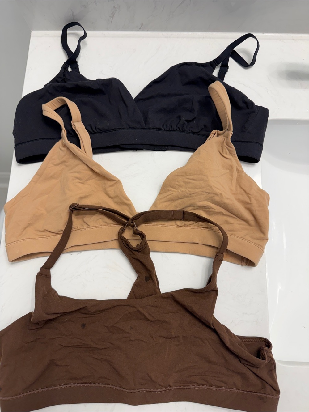 SKIMS Bralette Trio in Black, Tan, and Brown